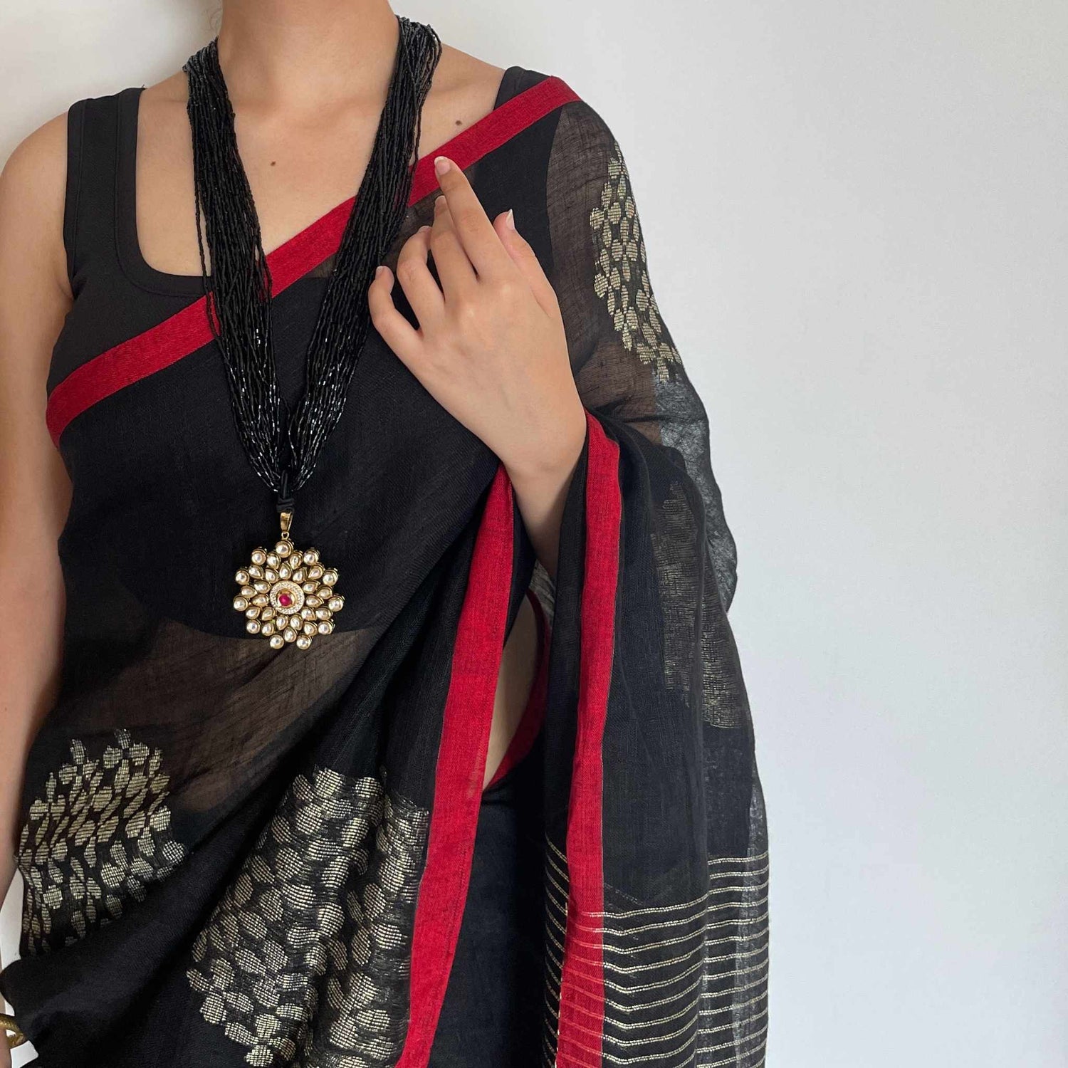 Krishna, Black Khadi Saree with Red Border and Zari Work by Shobhangini