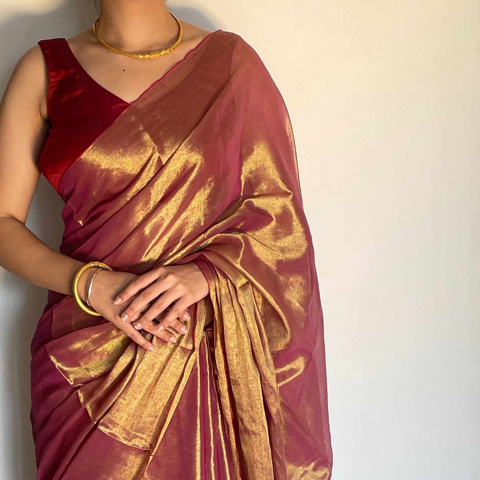 Madhura, Sunset Pink Raga Cotton Tissue Saree with Golden Zari Work by Shobhangini