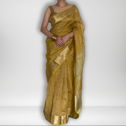 Yellow crush tissue saree with Banarasi border and golden zari work, Work by Shobhangini. Vibrant yellow saree, ideal for summer festivities.