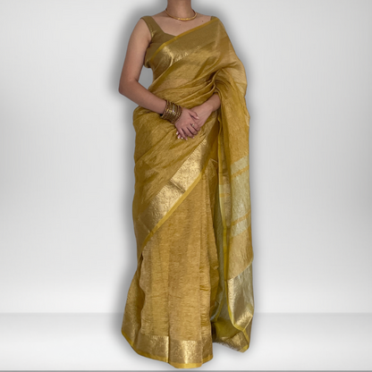 Yellow crush tissue saree with Banarasi border and golden zari work, Work by Shobhangini. Vibrant yellow saree, ideal for summer festivities.