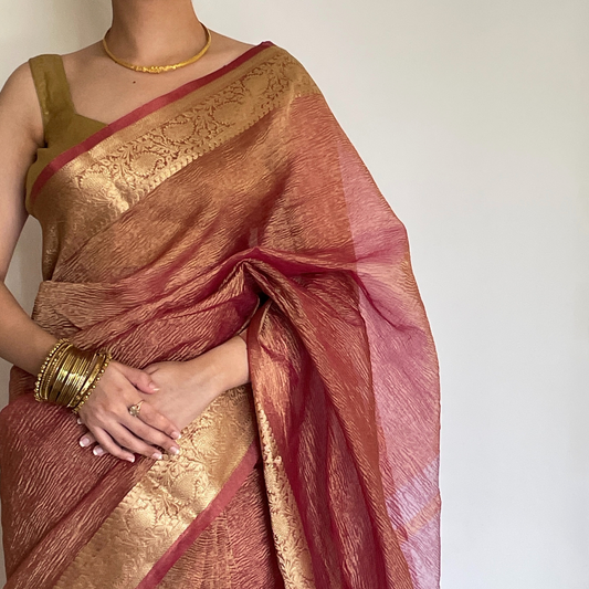 Pink crush tissue saree with Banarasi border and golden zari work, Work by Shobhangini. Elegant pink saree, perfect for feminine charm.