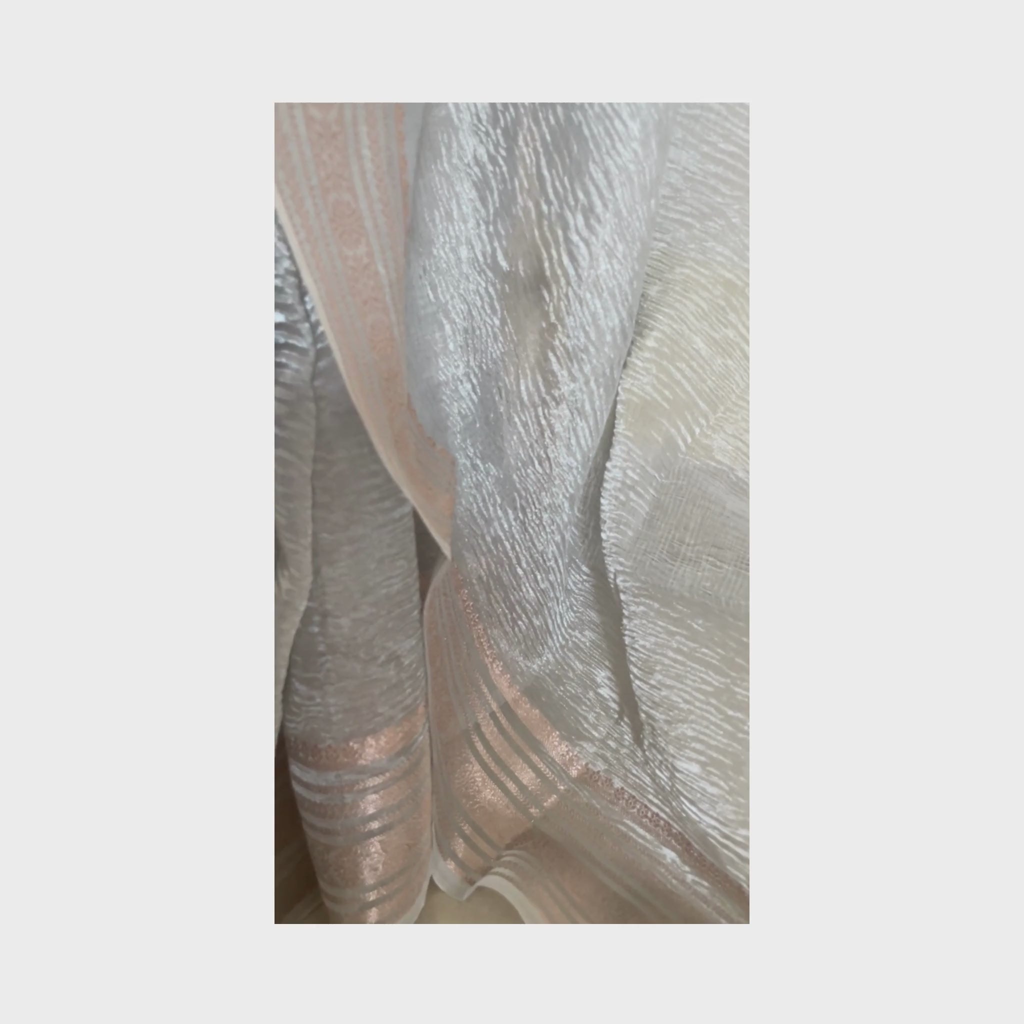 Silver metallic crush tissue saree with copper zari border, Work by Shobhangini. Modern silver saree, perfect for cocktail parties.